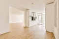 an empty living room with white walls and wood floors Royalty Free Stock Photo