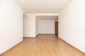 Empty living room with light wood flooring, ducted air conditioning