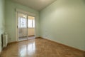 Empty living room with oak herringbone parquet flooring, light green Royalty Free Stock Photo