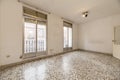 Empty living room with white terrazzo floor with black dots and aluminum and Royalty Free Stock Photo