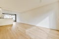 an empty living room with white walls and wood floors Royalty Free Stock Photo