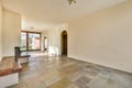 an empty living room with tile floors and a fireplace Royalty Free Stock Photo