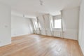 an empty living room with wood floors and white walls Royalty Free Stock Photo