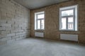 Empty loft room with brick wall and repair and without furniture for office Royalty Free Stock Photo