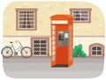 Empty London red classic telephone booth with an open door on the street with a bike at the building Royalty Free Stock Photo