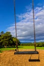 Empty lonely swing in the playgrouind Royalty Free Stock Photo