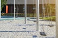 empty lonely swings in a modern park Royalty Free Stock Photo