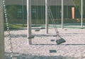 empty lonely swings in a modern park Royalty Free Stock Photo