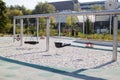 empty lonely swings in a modern park Royalty Free Stock Photo