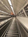 Empty Long Escalator Moving Up and Down to/from The Metro or Underground Train Station at Night Royalty Free Stock Photo