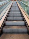 Empty long escalator steps with vanishing point image focus Royalty Free Stock Photo
