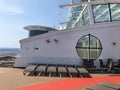 Lounge chairs on a cruise ship deck.