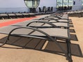 Lounge chairs on a cruise ship deck.