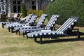 Empty lounge chairs at golf resort area background Royalty Free Stock Photo