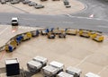 Empty luggage trolleys and ULD air cargo containers Royalty Free Stock Photo