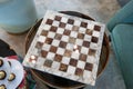 Empty marble chessboard on glass table