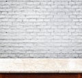 Empty marble table and white brick wall in background. product d