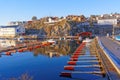 Empty marina docks with red