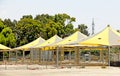 An empty market, shaded stands