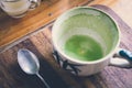 Empty matcha latte green tea cup on a wooden board Royalty Free Stock Photo