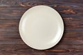 Empty matte round plate on wood table. top view Royalty Free Stock Photo