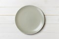 Empty matte round plate on wood table. top view Royalty Free Stock Photo