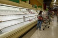 Empty meat display shelves at a Publix grocery store due to the people panicking and hoarding paper and food products Royalty Free Stock Photo