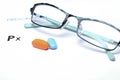 Empty medical prescription with glasses and pills above Royalty Free Stock Photo