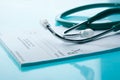 Empty medical prescription with a stethoscope Royalty Free Stock Photo