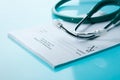 Empty medical prescription with a stethoscope Royalty Free Stock Photo