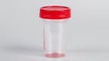 Empty Medical specimen container for urine analysis. Clear cup with secure blue cap. Concept of laboratory processing