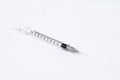 Empty medical syringe needle on white background Royalty Free Stock Photo