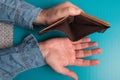 Men`s hands holding an empty leather wallet. Royalty Free Stock Photo