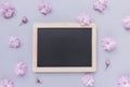 Empty message black board and fresh spring cherry blossom flowers