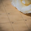 Empty message in schedule book of calendar with white rose flower Royalty Free Stock Photo
