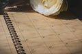 Empty message in schedule book of calendar with white rose flower Royalty Free Stock Photo