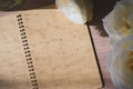 Empty message in schedule book of calendar with white rose flower Royalty Free Stock Photo