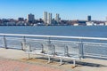 Empty Metal Bench at Pier I along the Hudson River with a Clear Blue Sky in New York City Royalty Free Stock Photo