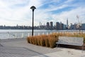 Empty Bench with Plants at a Park in Greenpoint Brooklyn New York looking out towards the East River and the Manhattan Skyline Royalty Free Stock Photo