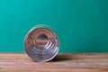 empty metal can on wooden table Royalty Free Stock Photo