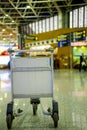 Empty metal cart for luggage standing at airport