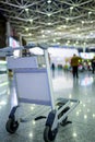 Empty metal cart for luggage standing at airport