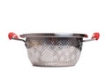 empty metal colander with red handles on white background, side view Royalty Free Stock Photo