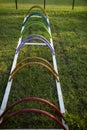 Empty metal colourful spiral bike rack available in a park. Royalty Free Stock Photo