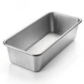 Empty metal loaf pan with fluted sides on a white background baking pan cake pan Royalty Free Stock Photo
