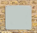 Empty metal plate on brick wall Royalty Free Stock Photo