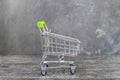 Empty metal shopping cart in a supermarket, side view Royalty Free Stock Photo