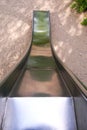 empty metal slide on playground Royalty Free Stock Photo