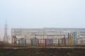Empty metal structures at the playground in the fog. Royalty Free Stock Photo