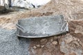 Empty metal trough for conveying concrete and mortar in construction. Construction fixtures for concrete work Royalty Free Stock Photo